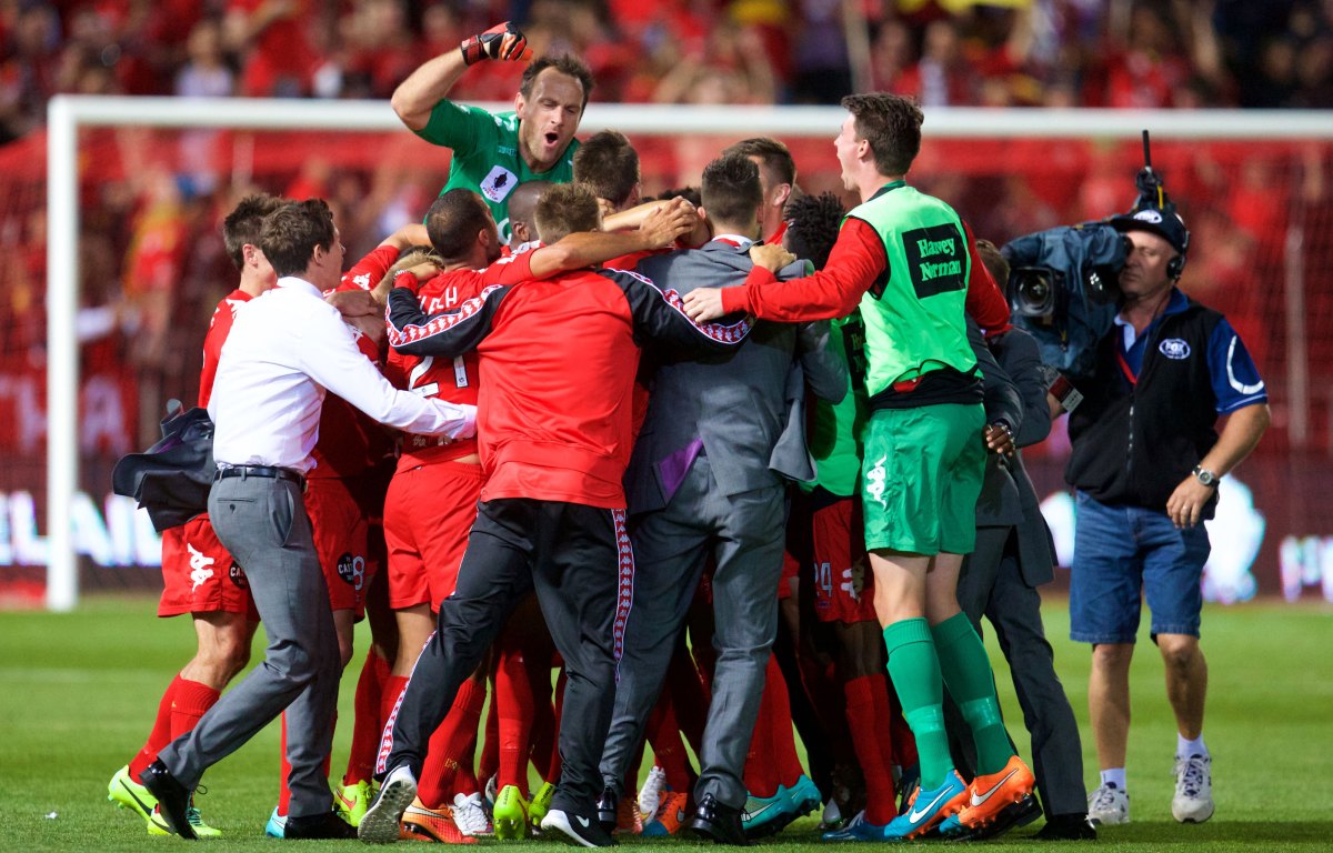 Eugene Galekovic rides high as the team celebrates on the pitch. Photo: Ryan Schembri/InDaily