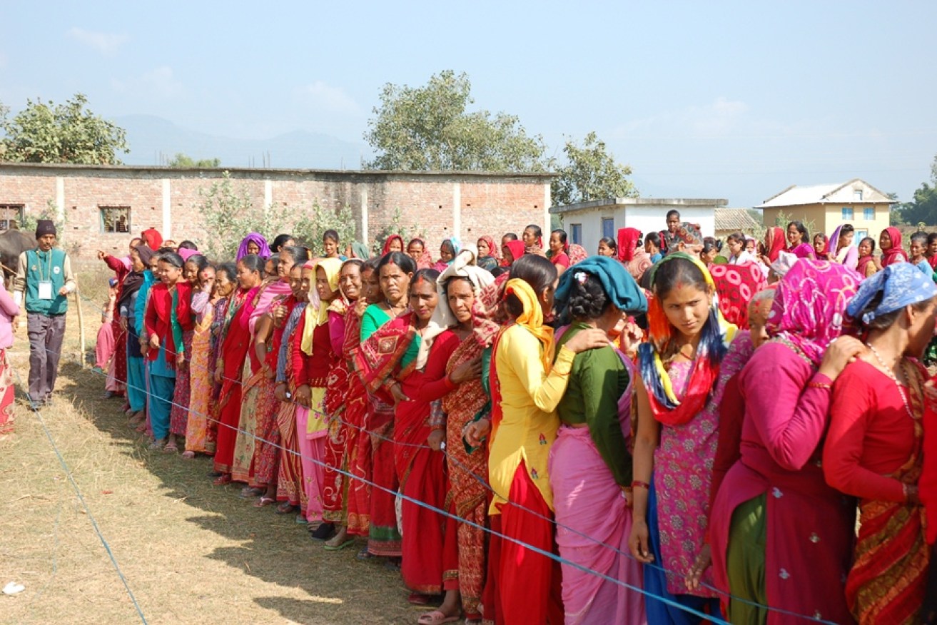 Nepalese villagers lining up for eye examinations.
