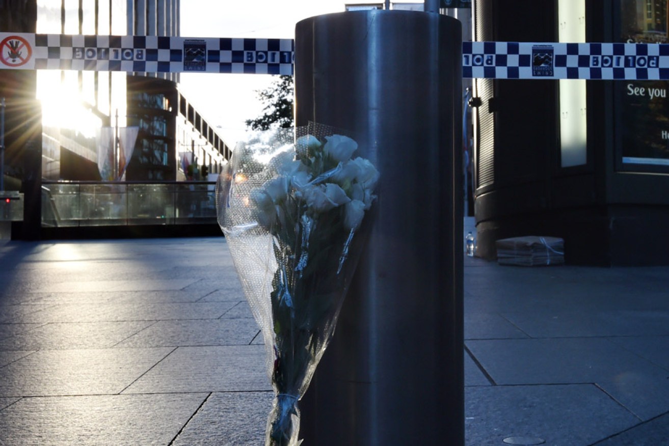 Flowers at the scene of the Sydney siege. Photo: AAP