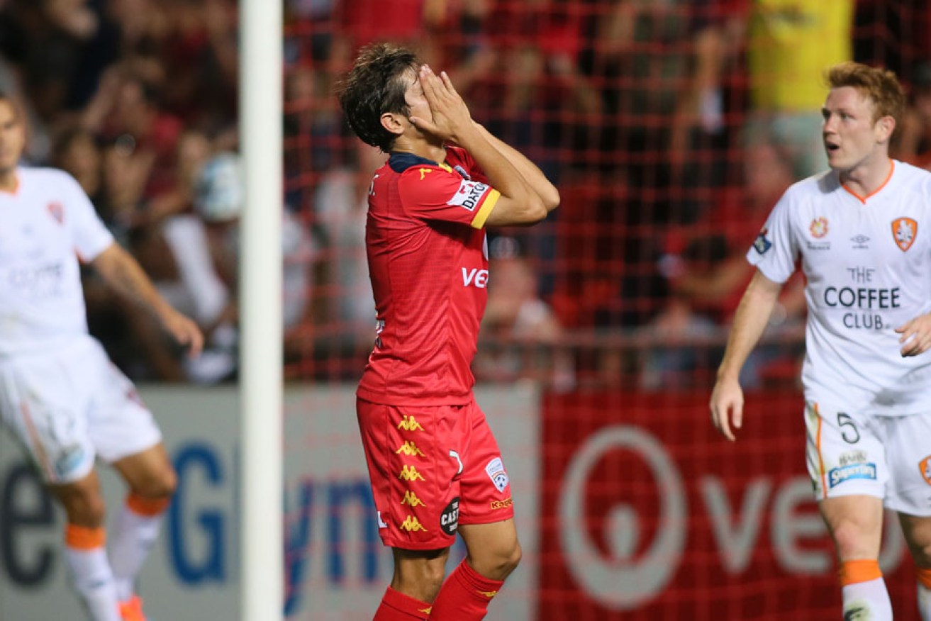 Pablo Sanchez of Adelaide United reacts after missing a easy shot for goal against the Roar.