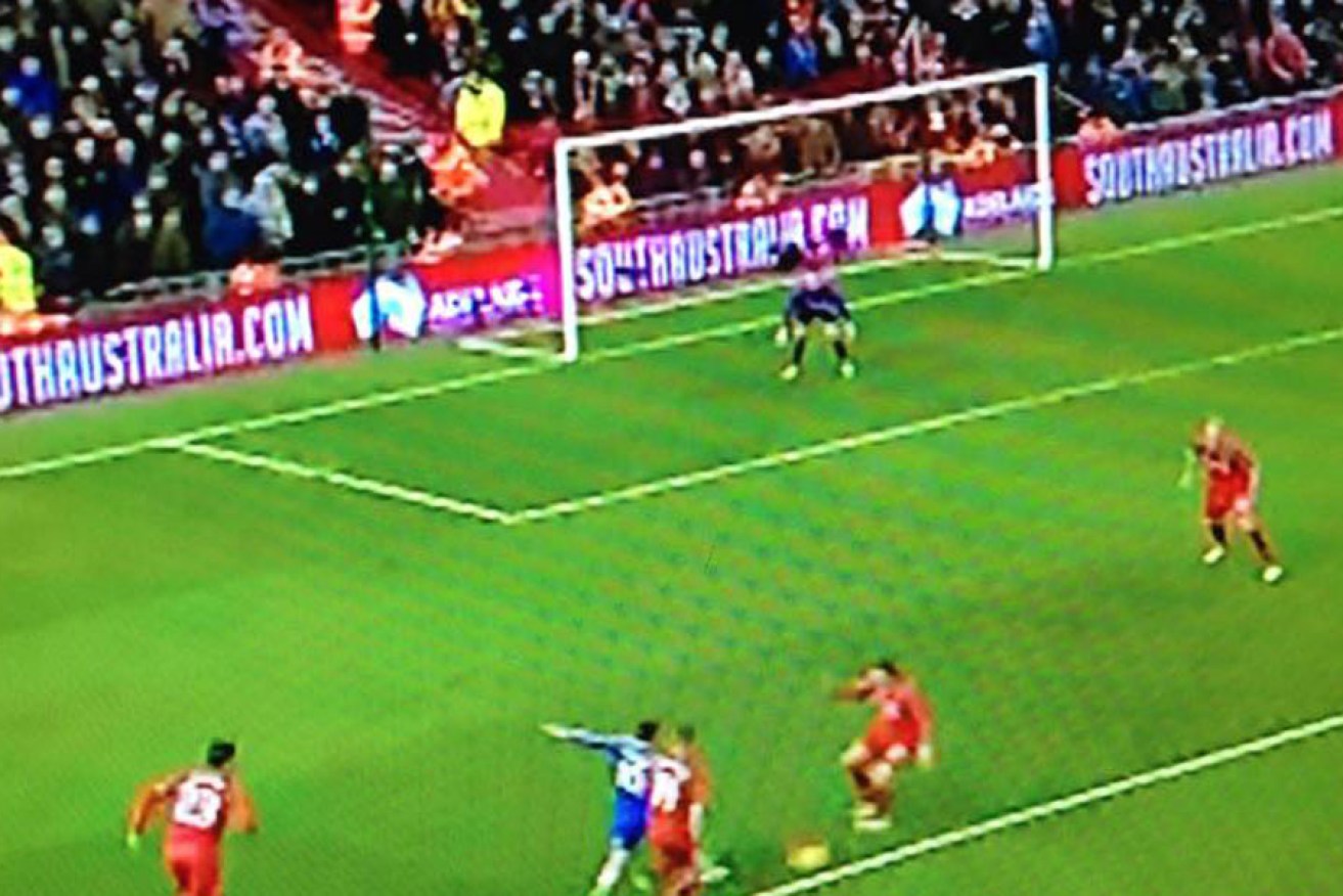 A screenshot of the action at Anfield overnight, with the South Australian advertising prominent behind the goal line.