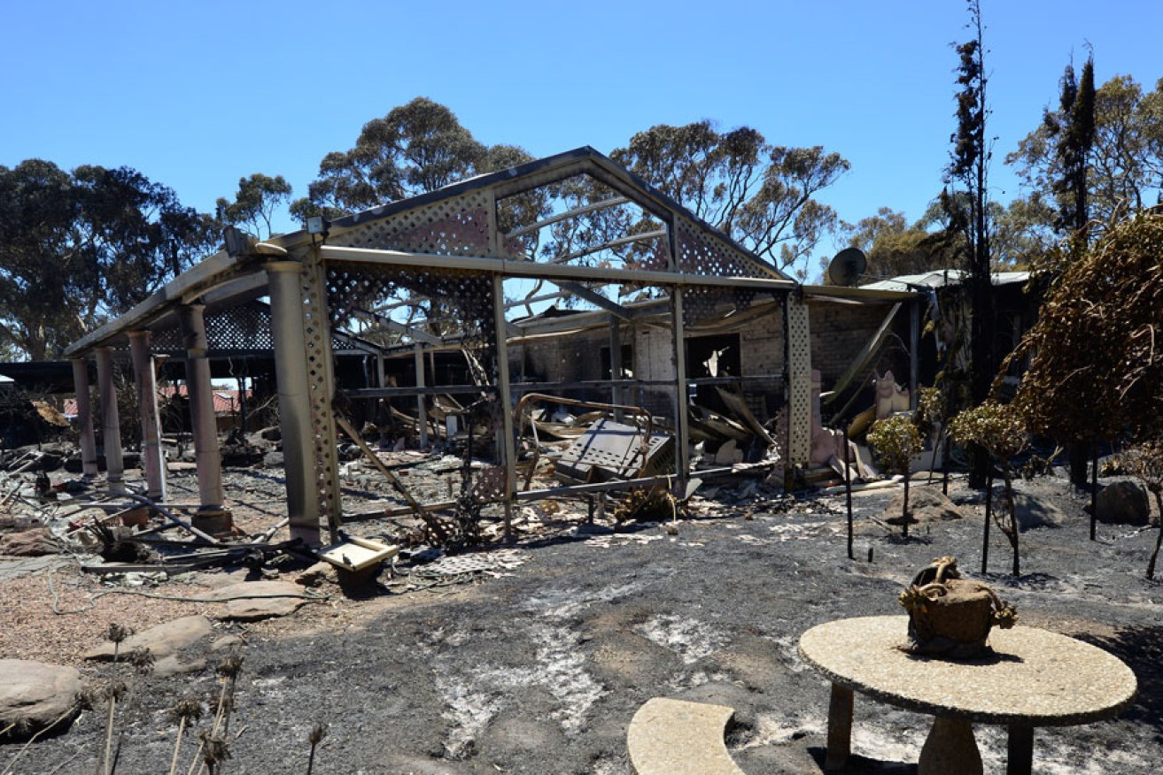 A gutted home in the fire zone. AAP image