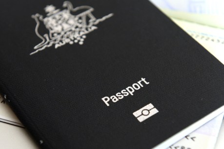 Optus should pay for new passports – PM