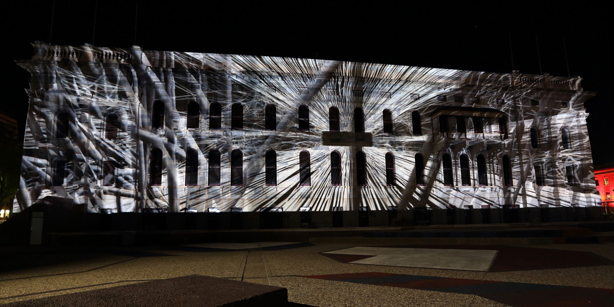 A-Synchron, by Laszio Zsolt Bordos, is a piece of 3D mapping projected onto the Festival Theatre roof and Parliament House façade. Photo: Tony Lewis