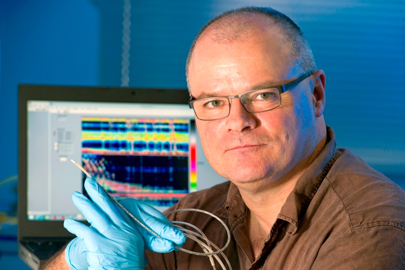 Flinders Professor John Arkwright with the novel fibre-optic catheter.