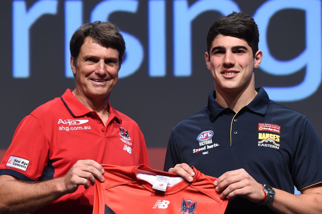 High hopes: Melbourne coach Paul Roos with #2 draft pick Christian Petracca during the AFL draft in November.