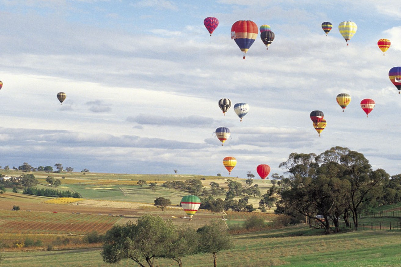 Hot-air balloons over the Barossa Valley. Photo: Neale Winter/SATC