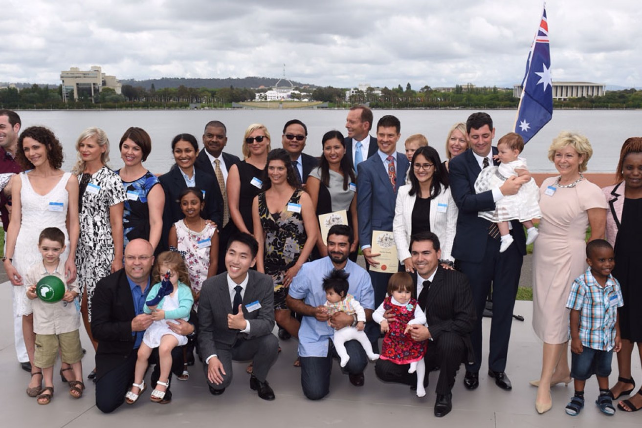 Prime Minister Tony Abbott with newly sworn-in citizens at an Australia Day citizenship ceremony in Canberra this year.