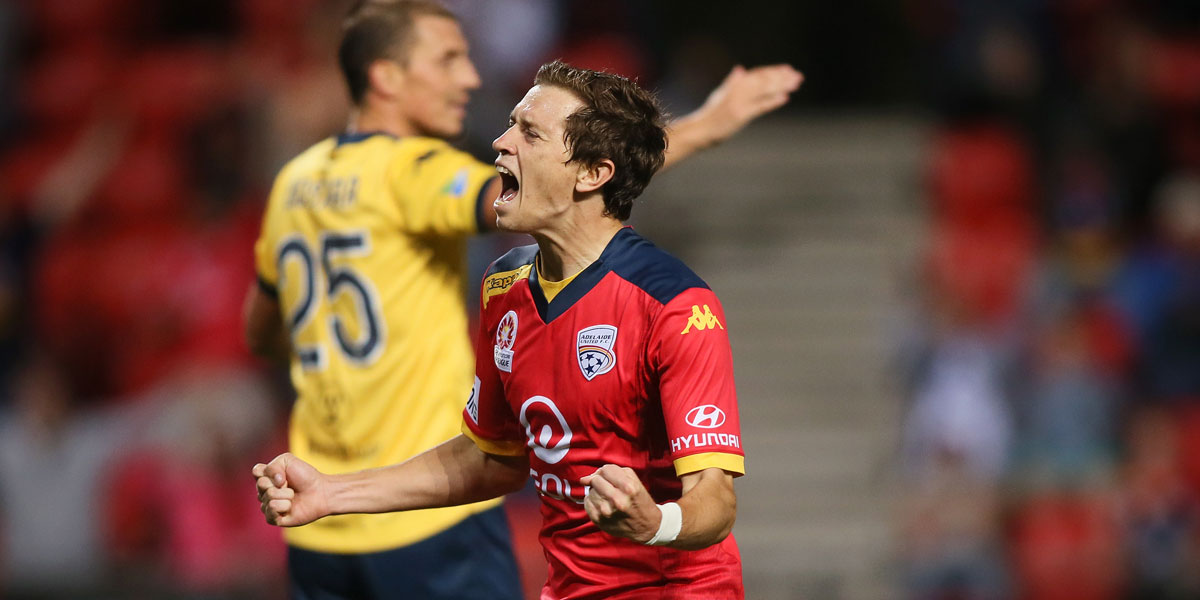 Craig Goodwin celebrates his winning goal against the Mariners.