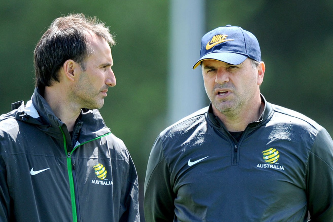 Olyroos coach Aurelio Vidmar (left) with Socceroos head coach Ange Postecoglou.
