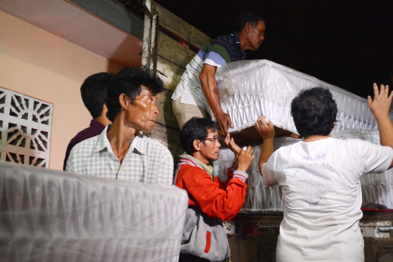 Undertakers with coffins prepared for death row inmates in Nusakambangan island, including Australian's Andrew Chan and Myuran Sukumaran.