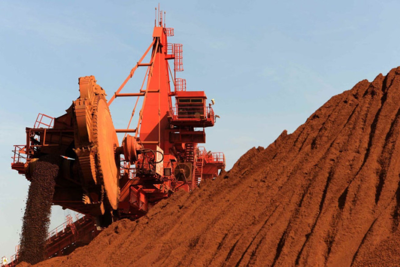 Iron ore being transported at a port in Rizhao, in China's Shandong province.