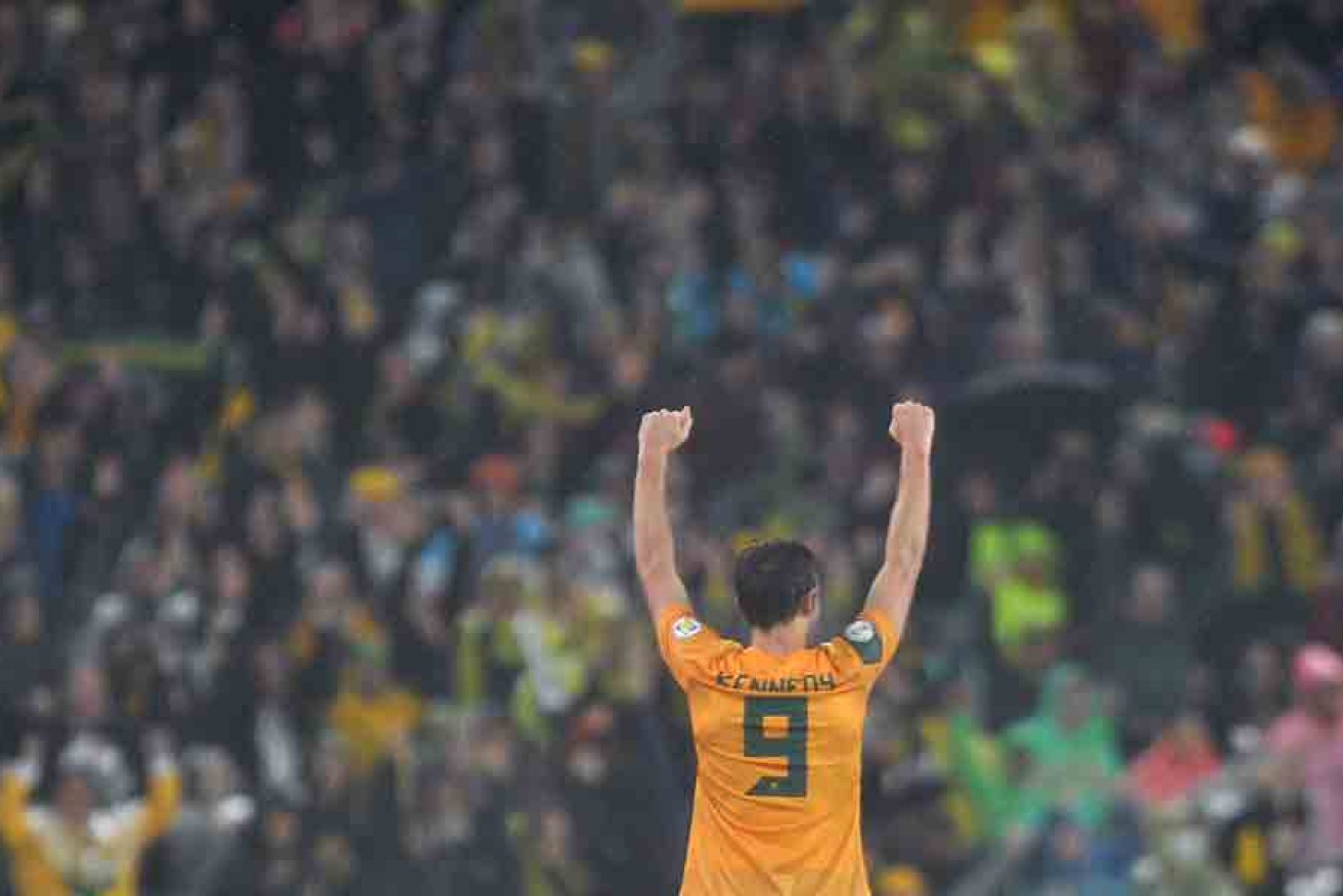 Josh Kennedy celebrates after his goal against Iraq in 2013 sealed the Socceroos' passage to the World Cup in Brazil.