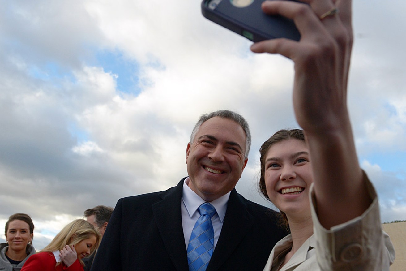 Joe Hockey gets a budget-day selfie with schoolgirl Anika Buining. Photo: AAP