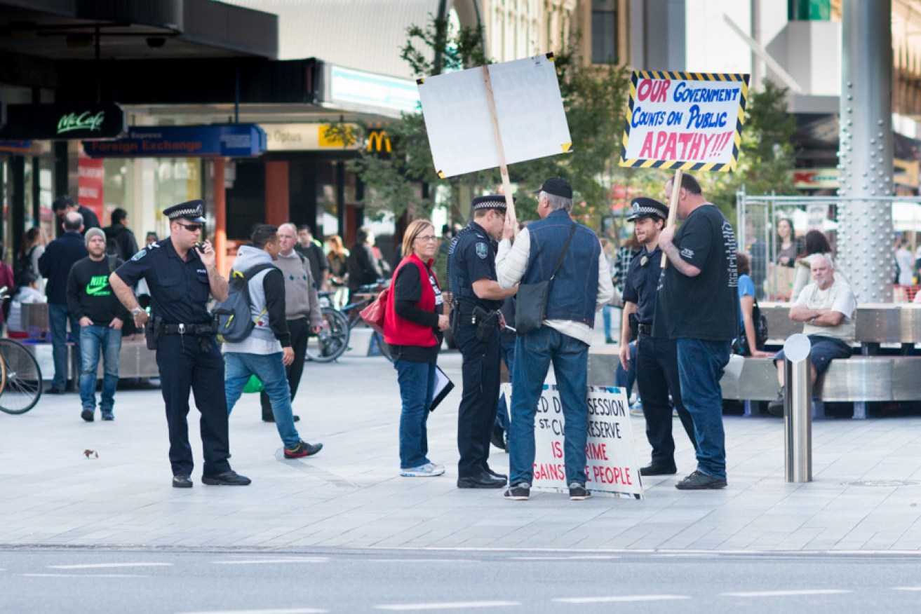 Police questioning protestors in Rundle Mall yesterday. Photo: Nat Rogers/InDaily