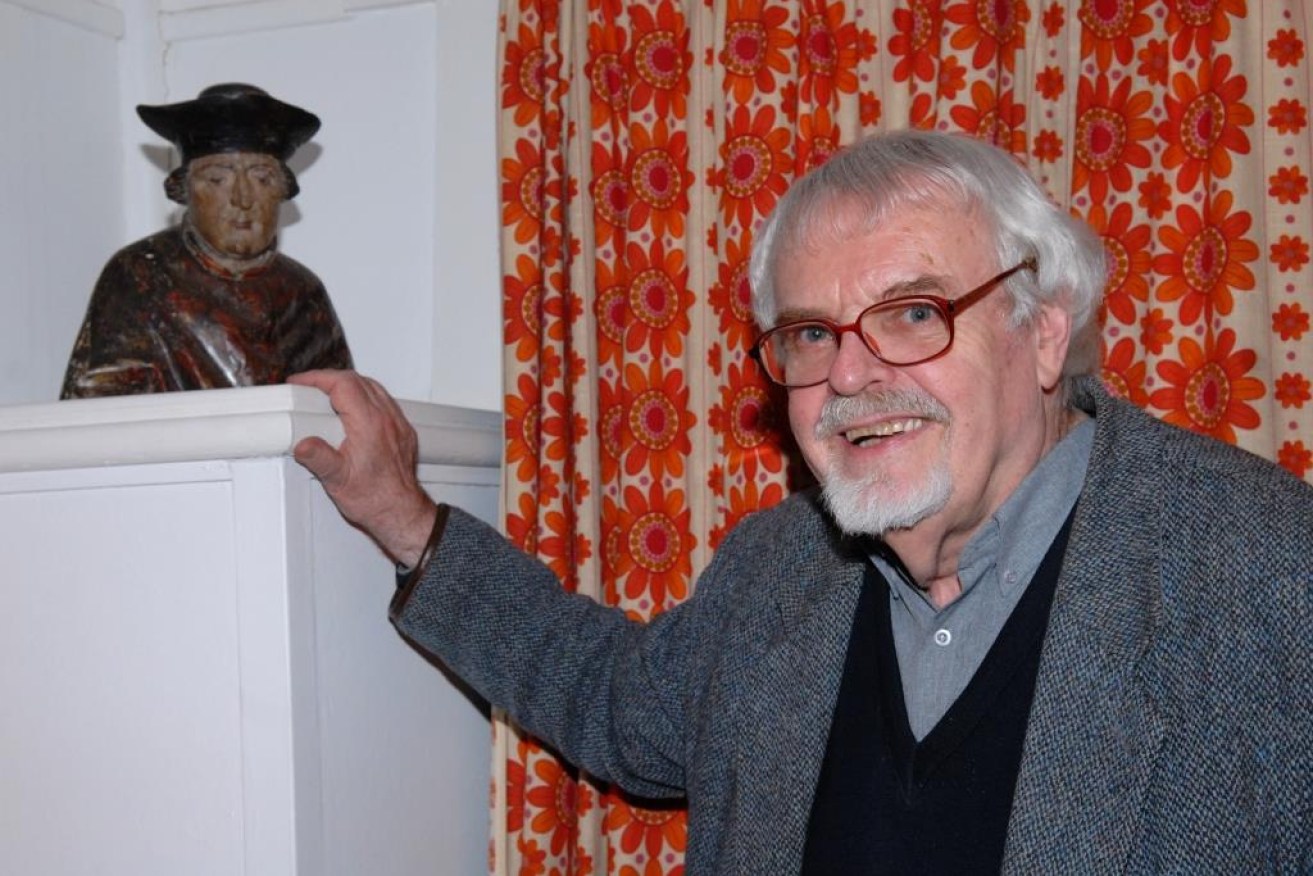 Professor Daalder with a polychrome wood carving of English Renaissance philosopher and statesman Sir Thomas More, c. 1560. 