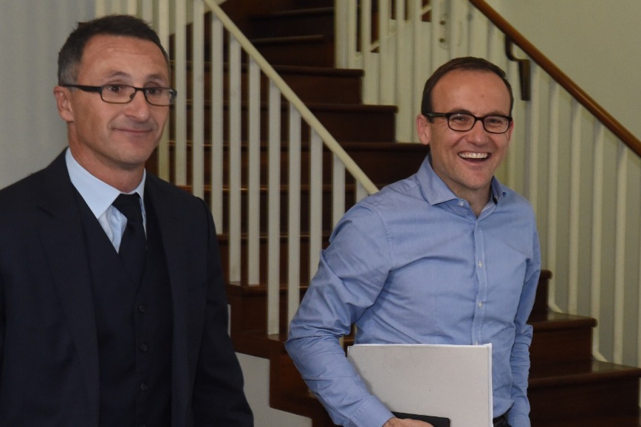 Richard Di Natale (left) arrives at today's ballot with fellow Green Adam Bandt.