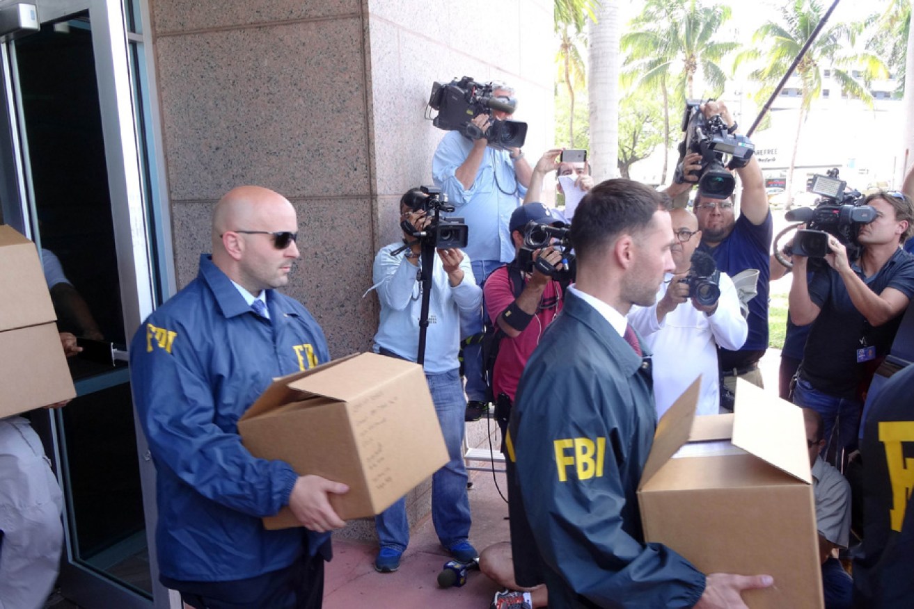 FBI agents take boxes with documents from the headquarters of soccer's American soccer governing body (CONCACAF) after a raid in Miami Beach, Florida.