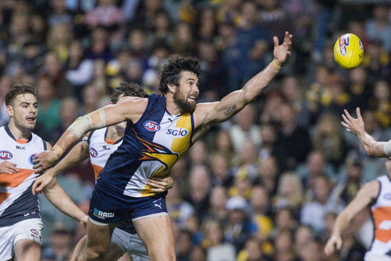 Josh Kennedy on his way to kicking six goals against GWS.