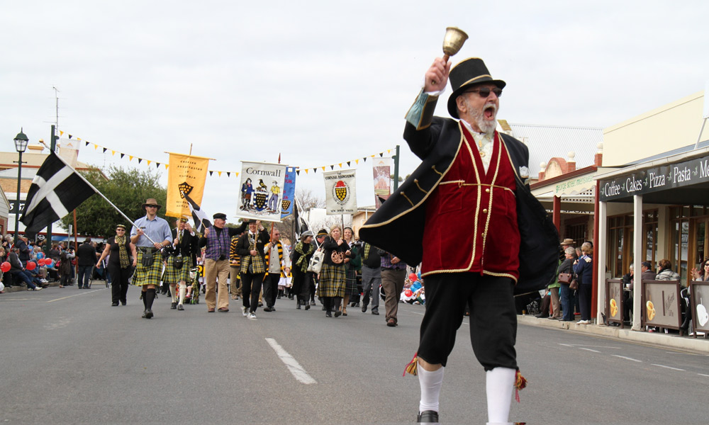 The town crier leads the Kernewek Lowender procession.