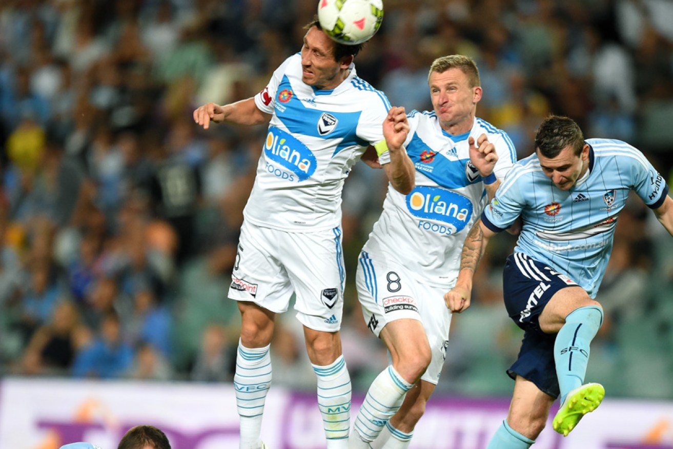 Mark Milligan of Melbourne Victory heads the ball during the February 14 match against Sydney FC. 