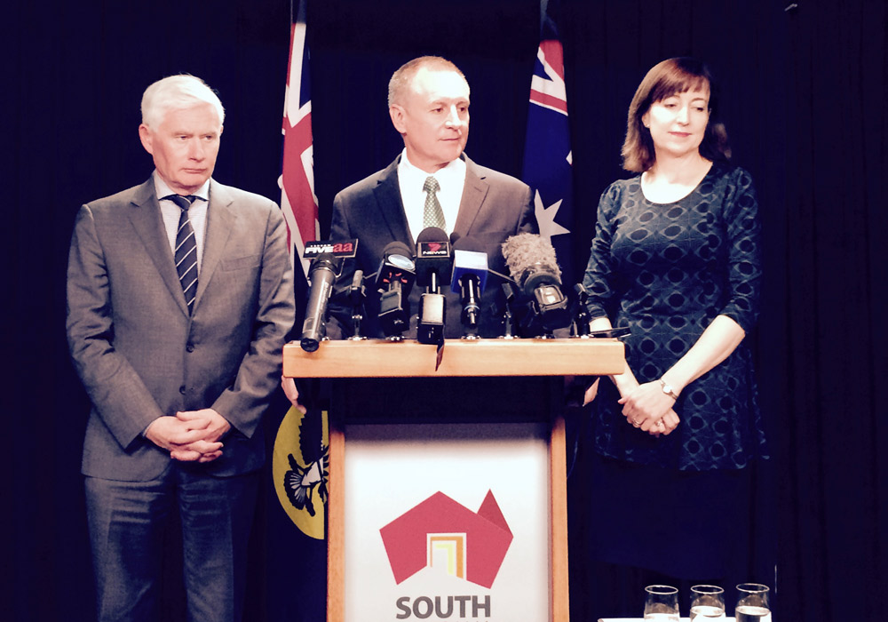 The Premier flanked by his ministers at today's presser.