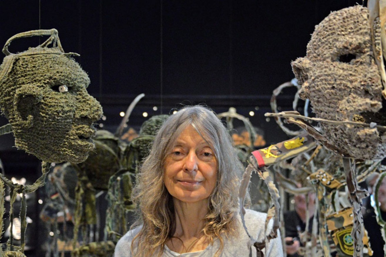South Australian artist Fiona Hall poses next her artwork 'Wrong Way Time' at the Venice Biennale in May.