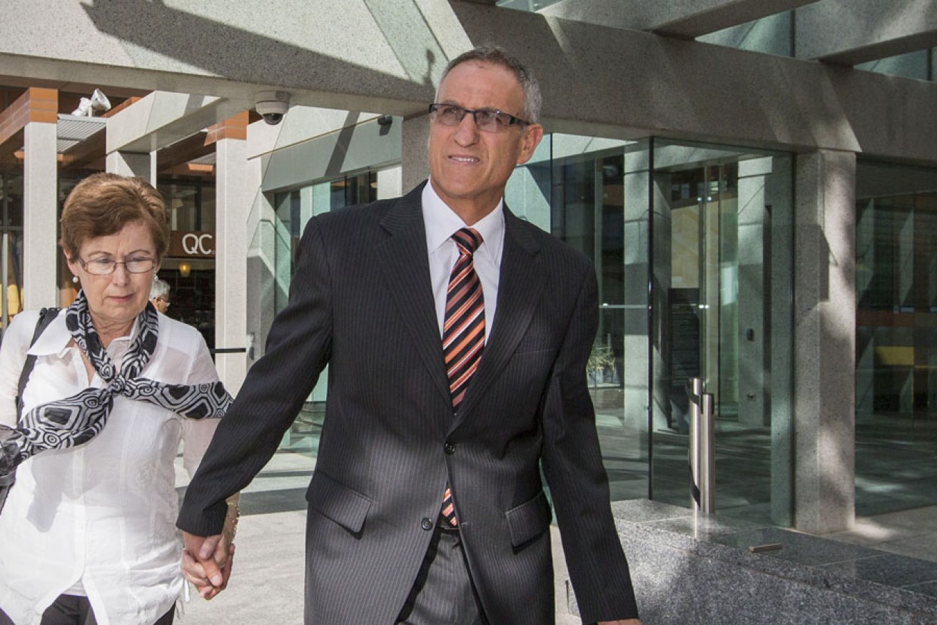 Former Principal of St Ann's Special School, Claude Hamam (right), leaves after giving evidence during the Royal Commission into Institutional Responses to Child Sexual Abuse in Adelaide in 2014.
