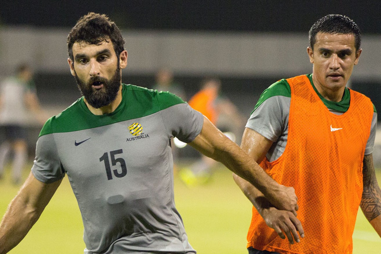 Socceroos captain Mile Jedinak (left) and star player Tim Cahill training in Dubai ahead of tonight's World Cup qualifier in Kyrgyzstan.