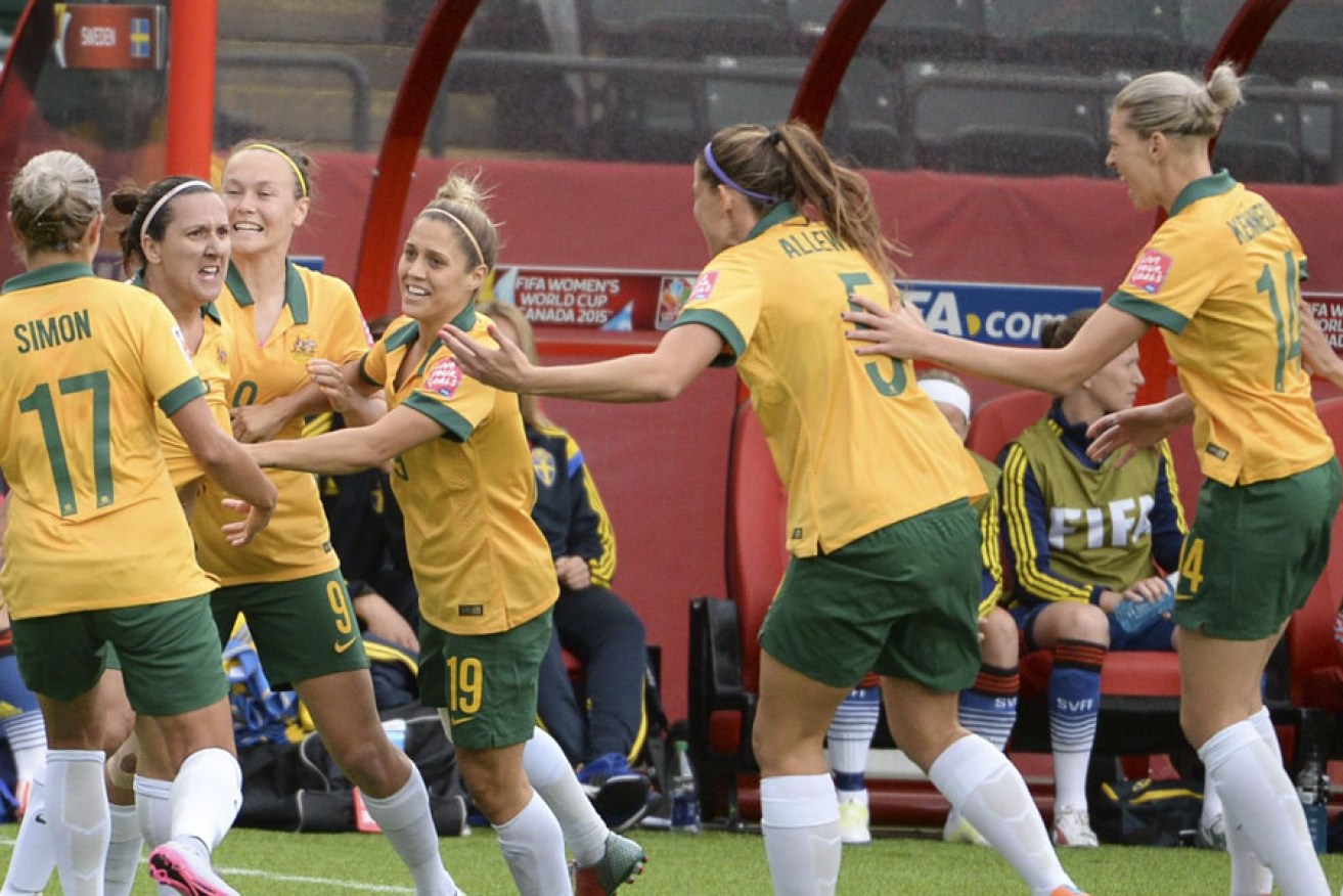 Lisa De Vanna (second from left) celebrates her goal against Sweden.