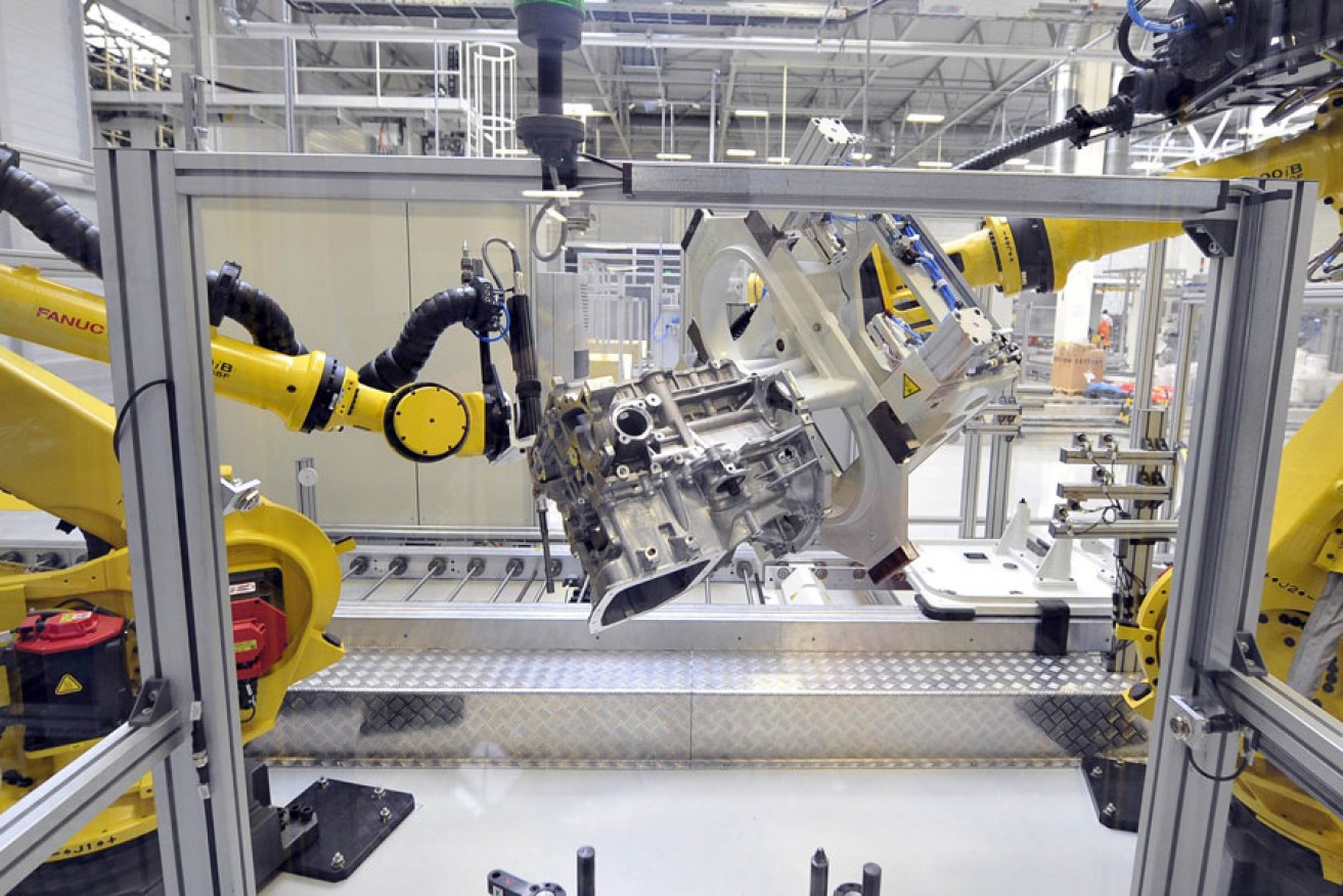 Robots assembling a car engine at the Kia factory in Slovakia.