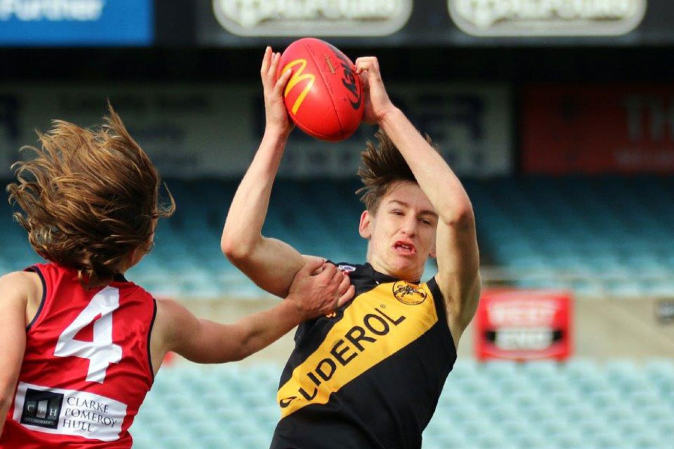 Bays footballer Declan Carmody taking a strong mark in the SANFL Under 15s Country grand final. Photo: Peter Argent