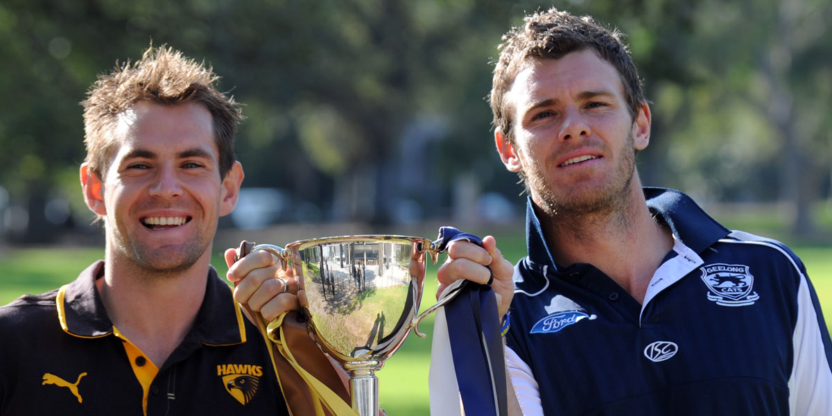 The AFL has been proactive about mental health: this 2010 picture shows Hawthorn's Luke Hodge and Geelong's Cameron Mooney with the "Beyond Blue" cup. AAP image 