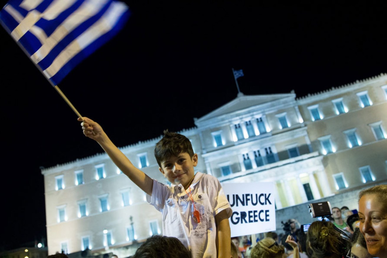 Supporters of 'No' vote celebrate in front of the Greek Parliament in Athens.