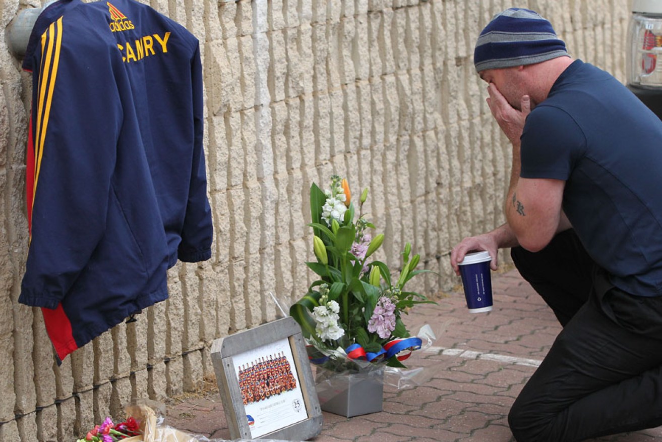 A grieving fan at West Lakes this morning. AAP image