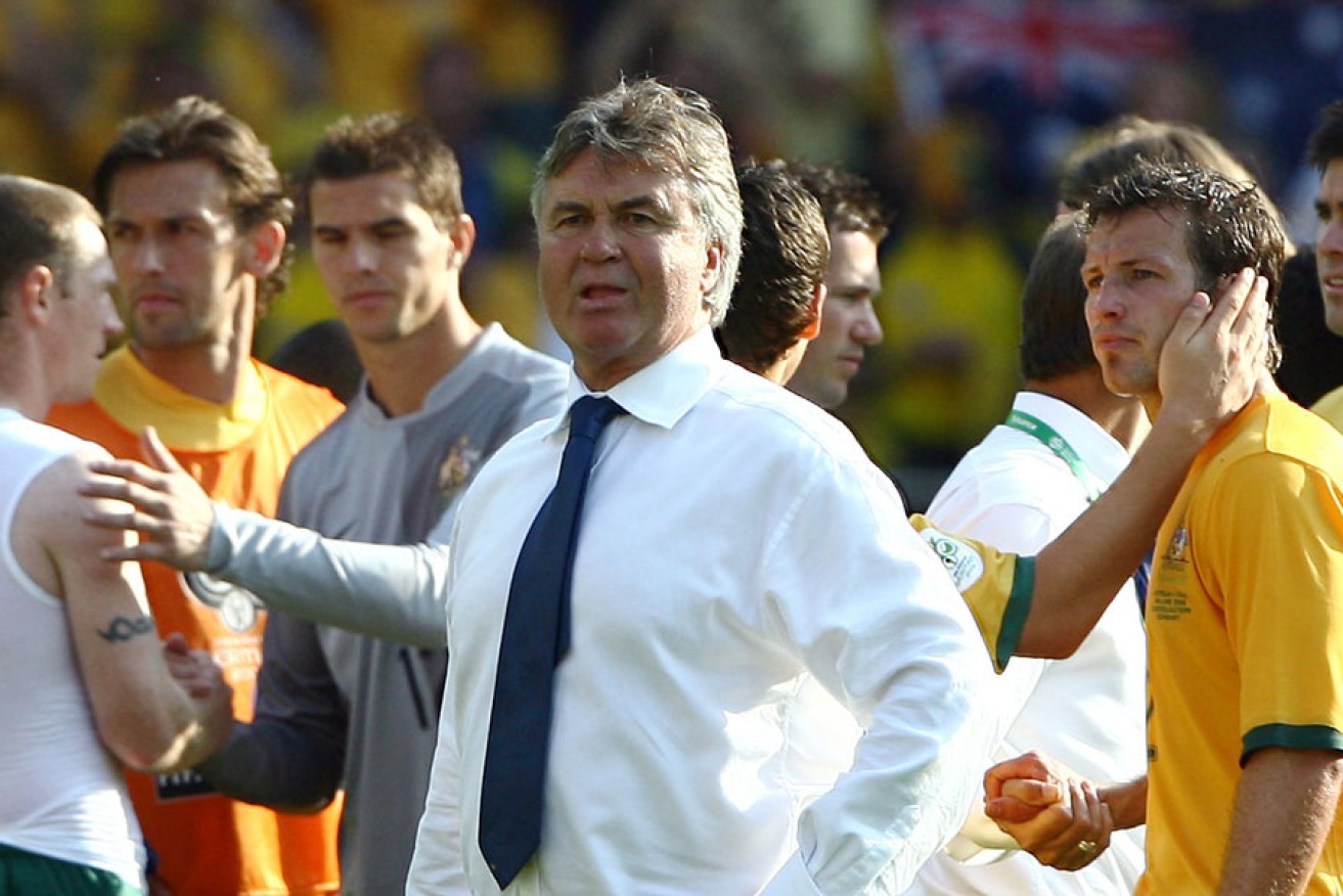 A dejected Guus Hiddink with Australian players after losing to Italy in the round of 16 match at the 2006 World Cup. AFP photo 