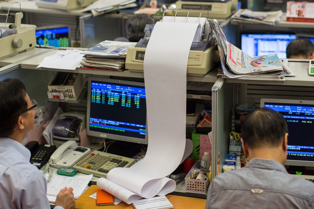 Stockbrokers monitor plunging share prices in Hong Kong.