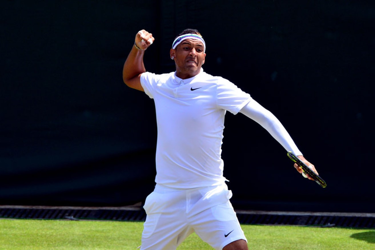 Nick Kyrgios celebrates a break of serve during his match against Milos Raonic at Wimbledon.