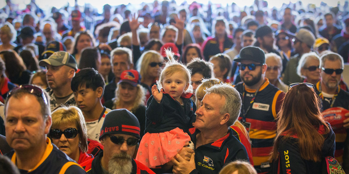 Fans flow in to Adelaide Oval on Sunday to remember Phil Walsh. AAP image