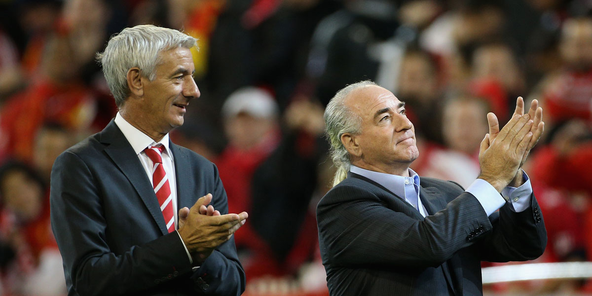 Legends together: Ian Rush (left) and Craig Johnston do a lap of honour at half time during the 2013 pre-season tour match of Liverpool FC against Melbourne Victory at the MCG. AAP image