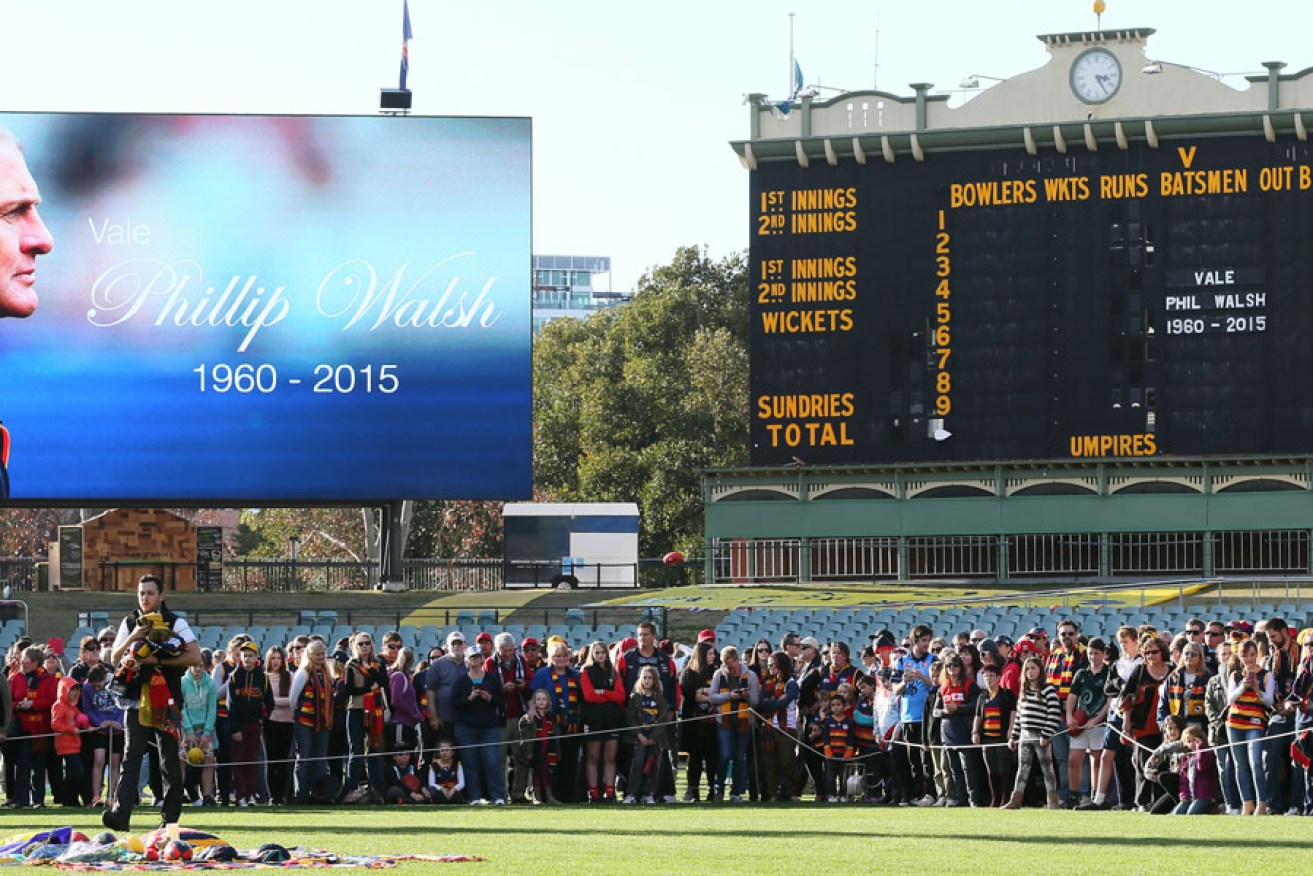 Some of the 20,000 people who gathered at Adelaide Oval in tribute to Phil Walsh. AAP image