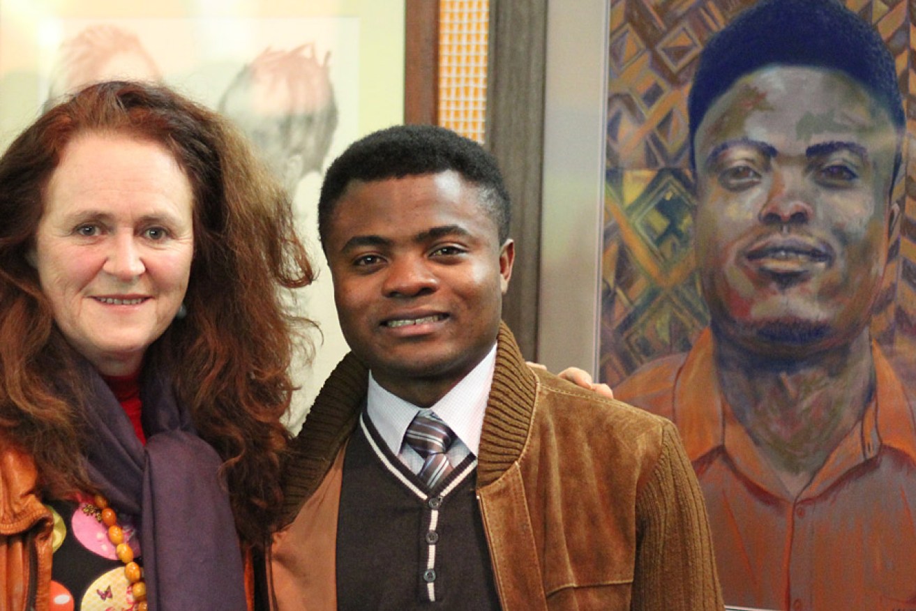 Lauryn Arnott with refugee Safari Bahizire and her portait of him.