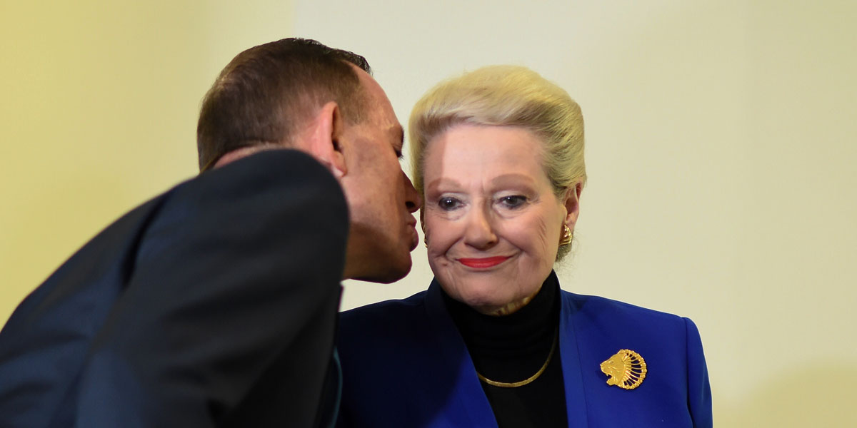 Tony Abbott kisses Bronwyn Bishop after the party room selected its choice for her replacement as Speaker. AAP image