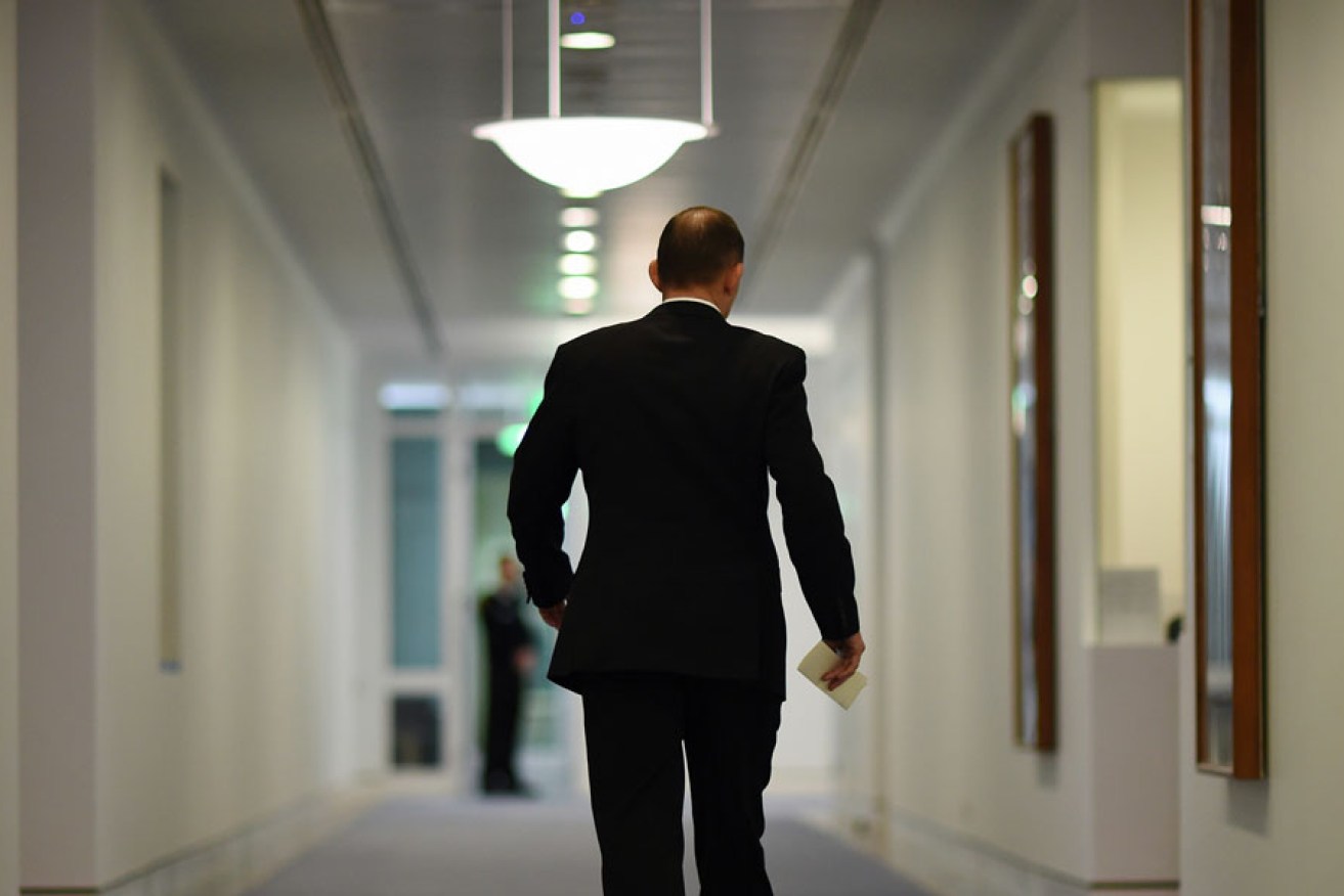 Prime Minister Tony Abbott leaves a media conference after announcing the Coalition's position on a same sex marriage conscience vote.