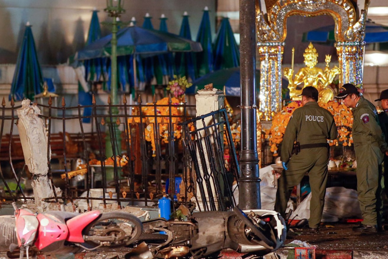 Police officers at the scene of an explosion near Erawan Shrine in central Bangkok, Thailand.