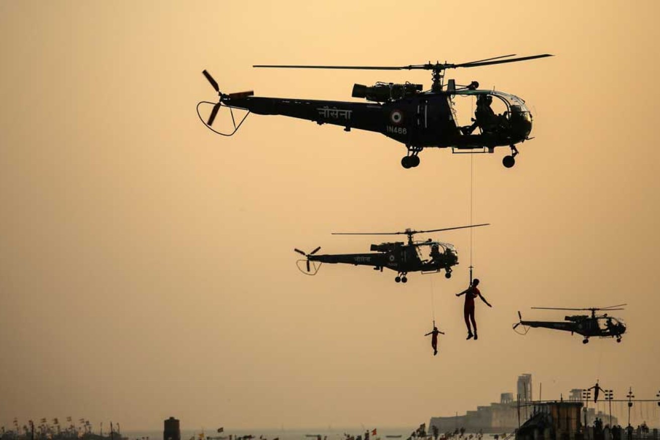 Indian Navy marine commandos demonstrate their skills during a pre-Navy Day celebration in Mumbai.
