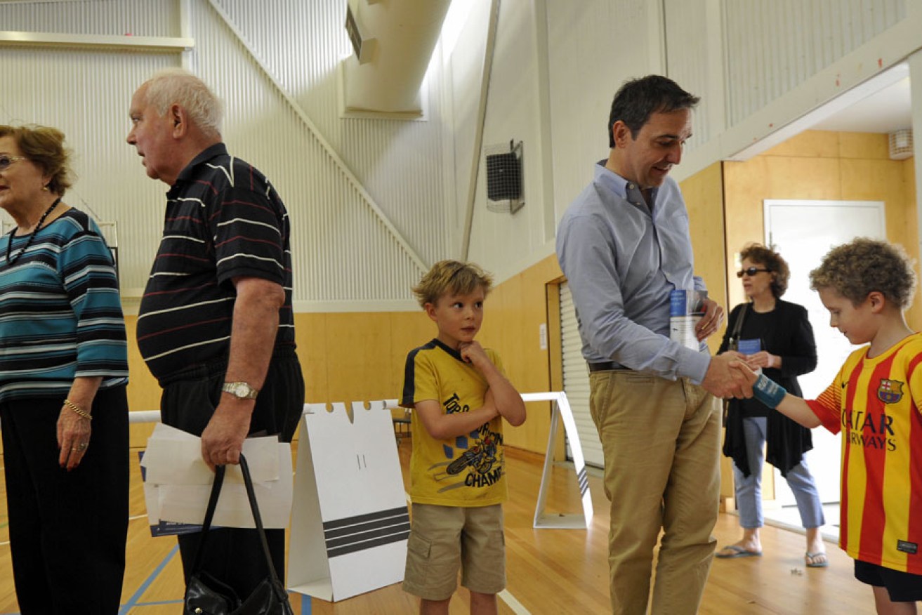 SA Liberal leader Steven Marshall lines up to vote at the March 2014 election, which delivered a 53-47 two party preferred win to the Liberals - but an overall electoral loss.