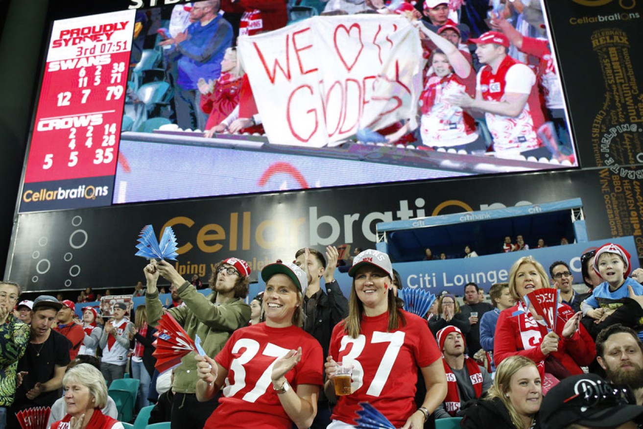 Swans fans applaud Adam Goodes at the seventh minute of the third quarter against the Crows.