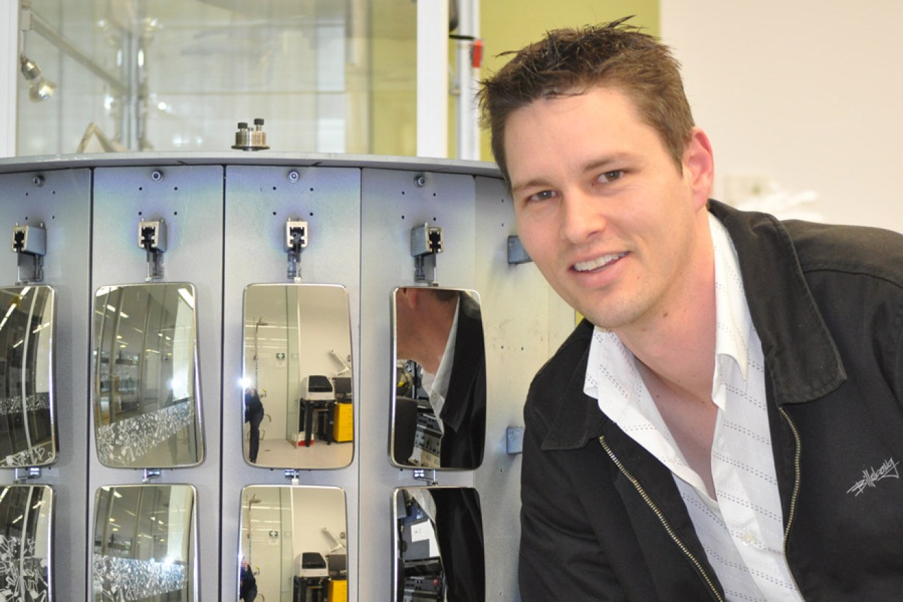 Associate Professor Drew Evans with world-first plastic car mirrors.