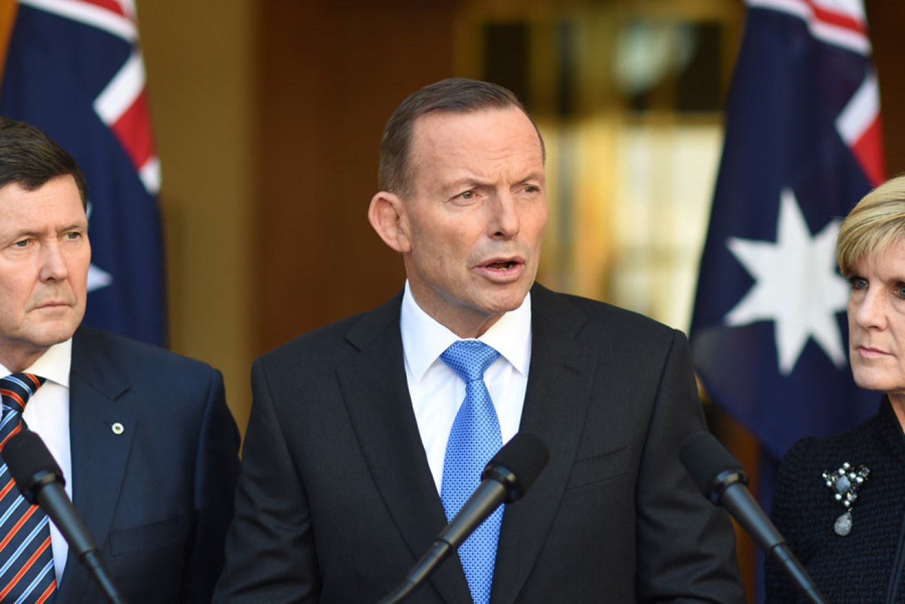Prime Minister Tony Abbott addresses the media this morning, flanked by Defence Minister Kevin Andrews and Foreign Minister Julie Bishop.